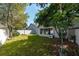 Spacious backyard with large trees and grassy area at 2011 Se Twin Bridge Cir, Ocala, FL 34471