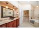 Relaxing bathroom with a soaking tub and walk-in shower at 2011 Se Twin Bridge Cir, Ocala, FL 34471