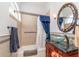 Bathroom with tub, shower, granite vanity, and decorative mirror at 2011 Se Twin Bridge Cir, Ocala, FL 34471