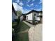 Landscaped walkway leading to the front entrance of the home at 2011 Se Twin Bridge Cir, Ocala, FL 34471