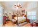 Elegant main bedroom with a post bed and ample closet space at 2011 Se Twin Bridge Cir, Ocala, FL 34471