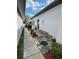 Stone pathway leads to a private side yard with landscaping at 2011 Se Twin Bridge Cir, Ocala, FL 34471