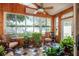 Peaceful sunroom filled with plants and natural light at 2011 Se Twin Bridge Cir, Ocala, FL 34471