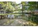 Wooden deck overlooking a tranquil lake at 20820 River Dr # B17, Dunnellon, FL 34431