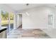 Bright dining room with wood-look flooring and sliding glass doors at 2295 Sw 142Nd Court Rd, Ocala, FL 34481