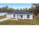 New construction home featuring a gray roof and neatly landscaped lawn at 2856 Sw 159 Ct, Ocala, FL 34481