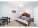 Bright bedroom with a king-size bed and a home office area at 3819 Se 38Th Loop, Ocala, FL 34480