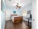 Bedroom with wood flooring, ceiling fan, and a built-in desk at 3819 Se 38Th Loop, Ocala, FL 34480