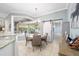 Kitchen dining area with sliding barn door and view to pool at 3819 Se 38Th Loop, Ocala, FL 34480