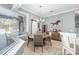 Casual dining area with round table and chairs, near sliding barn door at 3819 Se 38Th Loop, Ocala, FL 34480