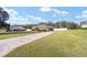 Long driveway leading to a house with a large yard at 3819 Se 38Th Loop, Ocala, FL 34480