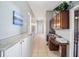 Bright hallway with built-in desk and granite countertop at 3819 Se 38Th Loop, Ocala, FL 34480