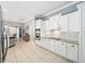 Modern kitchen with white cabinets and granite countertops at 3819 Se 38Th Loop, Ocala, FL 34480