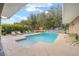 Inviting pool area with lounge chairs, and a tranquil water feature at 3819 Se 38Th Loop, Ocala, FL 34480