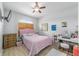 Charming bedroom with a pink bed and a vanity at 4864 Sw 103Rd Street Rd, Ocala, FL 34476