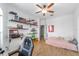 Cozy bedroom with built-in shelving and a daybed at 4864 Sw 103Rd Street Rd, Ocala, FL 34476