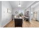 Luminous dining room with wooden floors and large window at 4864 Sw 103Rd Street Rd, Ocala, FL 34476