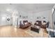 Living room with leather sofas and a wood-look floor at 4864 Sw 103Rd Street Rd, Ocala, FL 34476