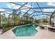 Inviting screened pool with ample lounge chairs at 4864 Sw 103Rd Street Rd, Ocala, FL 34476