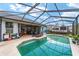 Large screened pool with patio furniture at 4864 Sw 103Rd Street Rd, Ocala, FL 34476