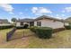 Private backyard with lush landscaping and a black metal fence at 4911 Sw 63Rd Loop, Ocala, FL 34474