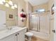 Updated bathroom with a vanity, toilet, and shower/tub combo at 4911 Sw 63Rd Loop, Ocala, FL 34474