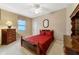 Cozy bedroom with hardwood floors, ceiling fan and large windows at 4911 Sw 63Rd Loop, Ocala, FL 34474