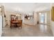 Dining room with tile floors, chandelier and view into kitchen at 4911 Sw 63Rd Loop, Ocala, FL 34474