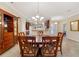 Open dining room with tile floors and a view to kitchen and entry at 4911 Sw 63Rd Loop, Ocala, FL 34474