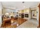 Living room with hardwood floors, fireplace and built-in shelving at 4911 Sw 63Rd Loop, Ocala, FL 34474