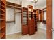 Large walk-in closet with custom built-in shelving and rods at 4911 Sw 63Rd Loop, Ocala, FL 34474