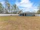 Large backyard with a screened patio and privacy fence at 4947 Sw 166Th Loop, Ocala, FL 34473