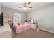 Bedroom with a bed, desk, and plenty of storage at 4947 Sw 166Th Loop, Ocala, FL 34473