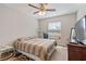 Bright bedroom featuring a comfortable bed and large window at 4947 Sw 166Th Loop, Ocala, FL 34473