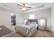 Well-lit bedroom with a large bed and walk-in closet at 4947 Sw 166Th Loop, Ocala, FL 34473