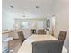 Modern dining area with white table and gray chairs at 4947 Sw 166Th Loop, Ocala, FL 34473