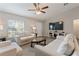 Bright living room featuring two sofas, a coffee table, and a large TV at 4947 Sw 166Th Loop, Ocala, FL 34473