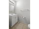 Simple and clean bathroom with white vanity and tiled floor at 4947 Sw 45Th Cir, Ocala, FL 34474