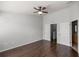 Spacious bedroom with wood flooring and ceiling fan at 4947 Sw 45Th Cir, Ocala, FL 34474