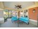 Covered patio with teal couches and a gray coffee table at 4947 Sw 45Th Cir, Ocala, FL 34474