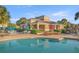 Resort-style pool with adjacent clubhouse and seating at 4947 Sw 45Th Cir, Ocala, FL 34474