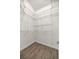 Large walk-in closet with wire shelving providing ample storage at 5015 Belted Kingfisher Dr, Oxford, FL 34484