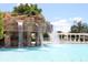 Resort-style pool with a waterfall feature at 5015 Belted Kingfisher Dr, Oxford, FL 34484