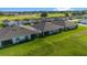 Aerial view of houses with gray roofs and screened porches at 5395 Nw 46Th Ln, Ocala, FL 34482