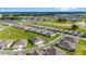 Aerial view of houses with gray roofs and screened porches at 5395 Nw 46Th Ln, Ocala, FL 34482