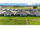 Aerial view of houses with gray roofs and screened porches at 5395 Nw 46Th Ln, Ocala, FL 34482