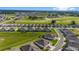 Aerial view of houses with gray roofs and screened porches at 5395 Nw 46Th Ln, Ocala, FL 34482