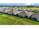 Aerial view of houses with gray roofs and screened porches at 5395 Nw 46Th Ln, Ocala, FL 34482