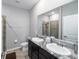 Modern bathroom with double vanity and a large shower at 5395 Nw 46Th Ln, Ocala, FL 34482