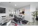 Modern dining room with glass table and gray chairs at 5395 Nw 46Th Ln, Ocala, FL 34482